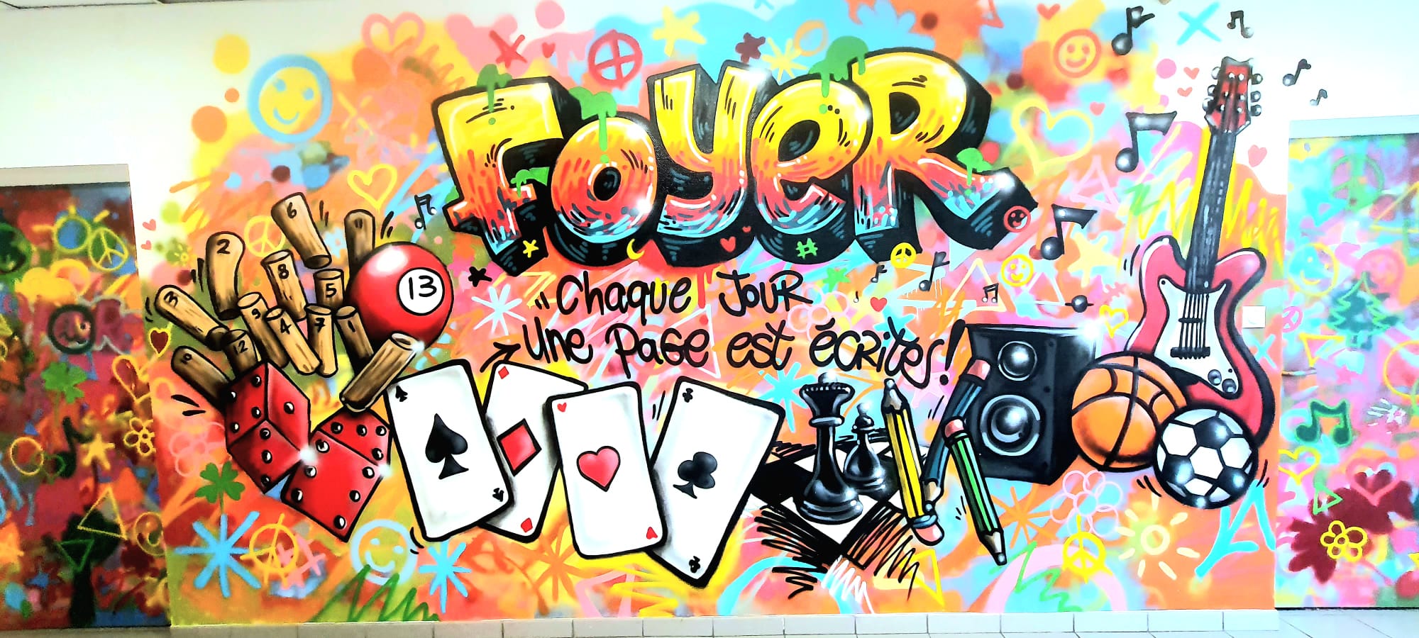 Décoration intérieure : fresque graffiti street-art pour le foyer d'un internat
